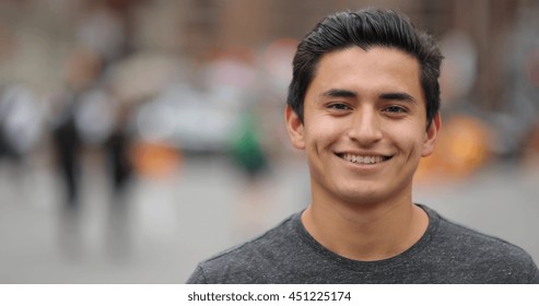 Young Hispanic Man In City Face Portrait