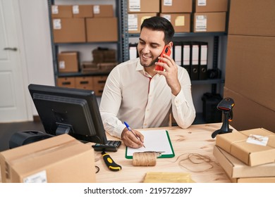 Young Hispanic Man E-commerce Business Worker Talking On The Smartphone At Office