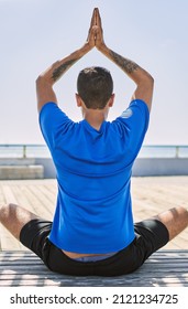 Young Hispanic Man Exercising Doing Tree Pose Outdoors