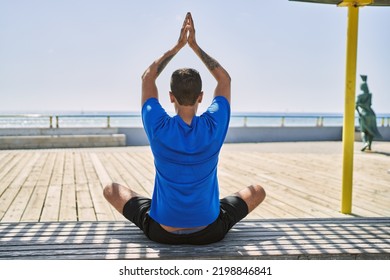 Young Hispanic Man Exercising Doing Tree Pose Outdoors