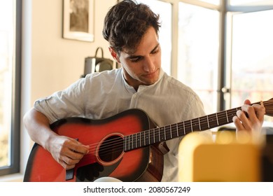 Young Hispanic Man Guitar Class Concept