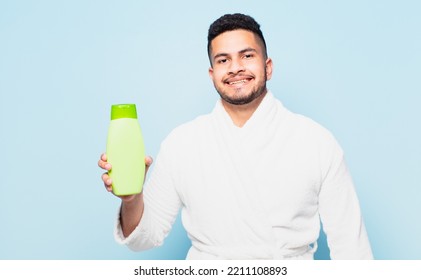 Young Hispanic Man Happy Expression And Wearing A Bathrobe