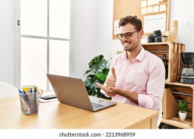 Young Hispanic Man Having Video Call Communicating With Deaf Sign Language At Office