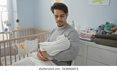 Young hispanic man holding baby indoors in bedroom cradle room surrounded by soft toys showcasing tender moment of fatherhood and nurturing environment.
