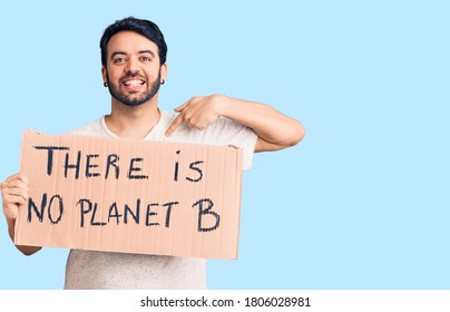 Young Hispanic Man Holding There Is No Planet B Banner Pointing Finger To One Self Smiling Happy And Proud 