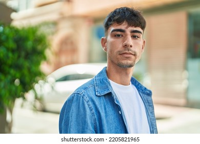 Young Hispanic Man Looking To The Camera With Serious Expression At Street