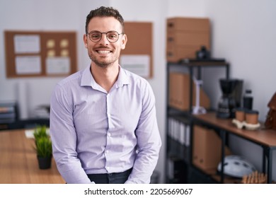 Young hispanic man at the office with a happy and cool smile on face. lucky person.  - Powered by Shutterstock