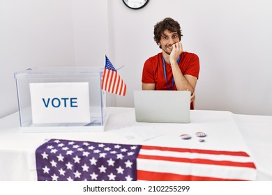 Young Hispanic Man At Political Election Sitting By Ballot Looking Stressed And Nervous With Hands On Mouth Biting Nails. Anxiety Problem. 