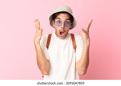 Young Hispanic Man Screaming With Hands Up In The Air. Summer Concept