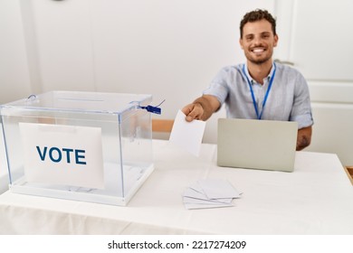 Young Hispanic Man Smiling Confident Holding Vote Working At Electoral College