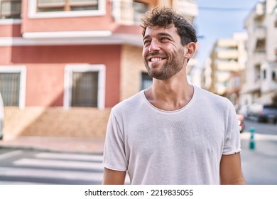 Young hispanic man smiling confident walking at street - Powered by Shutterstock