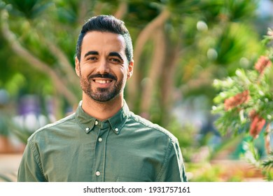 Young Hispanic Man Smiling Happy Standing At The Park.