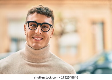 Young Hispanic Man Smiling Happy Wearing Glasses At The City.