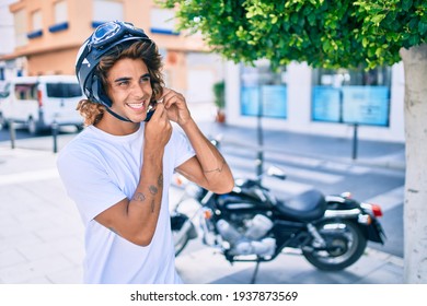 Young Hispanic Man Smiling Happy Wearing Moto Helmet Over Motorcycle At The City