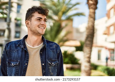 Young Hispanic Man Smiling Happy Standing At The City