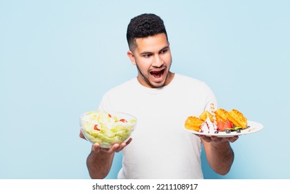 Young Hispanic Man Surprised Expression And Dieting Concept