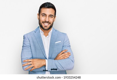 Young Hispanic Man Wearing Business Jacket Happy Face Smiling With Crossed Arms Looking At The Camera. Positive Person. 