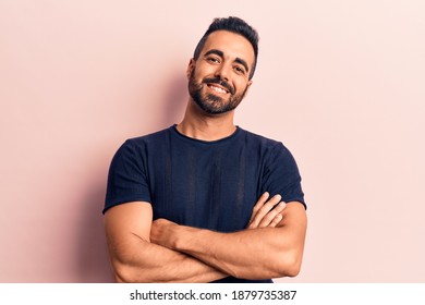 Young Hispanic Man Wearing Casual Clothes Happy Face Smiling With Crossed Arms Looking At The Camera. Positive Person. 