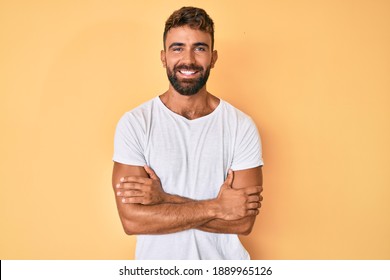 Young Hispanic Man Wearing Casual Clothes Happy Face Smiling With Crossed Arms Looking At The Camera. Positive Person. 