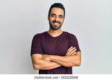 Young Hispanic Man Wearing Casual Clothes Happy Face Smiling With Crossed Arms Looking At The Camera. Positive Person. 