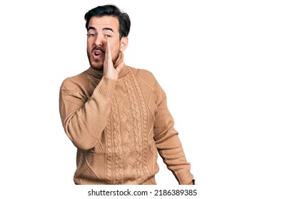 Young Hispanic Man Wearing Casual Clothes Hand On Mouth Telling Secret Rumor, Whispering Malicious Talk Conversation 