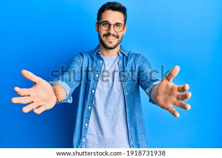 Similar – Image, Stock Photo Male hand comes out of a pile of leaves. Concept fall fun