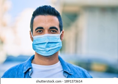 Young Hispanic Man Wearing Medical Mask Standing At The City.