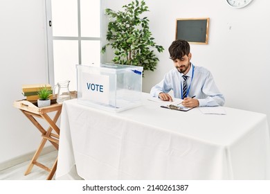 Young Hispanic Politic Party Worker Man Working At Electoral College.