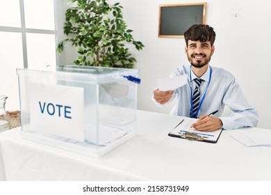 Young Hispanic Politic Party Worker Man Working At Electoral College.