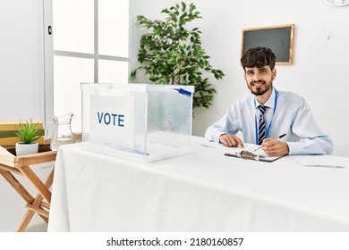 Young Hispanic Politic Party Worker Man Working At Electoral College.