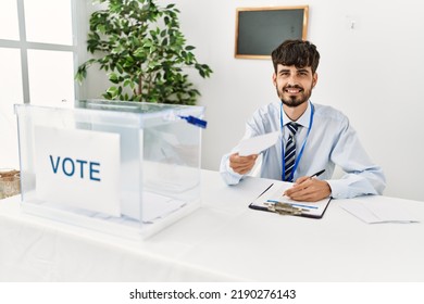 Young Hispanic Politic Party Worker Man Working At Electoral College.