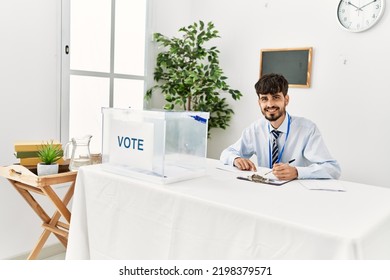 Young Hispanic Politic Party Worker Man Working At Electoral College.