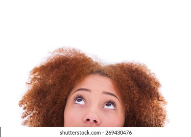 Young hispanic teenage girl looking up isolated on white background
