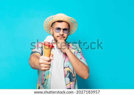 Similar – Man observing something through binoculars