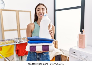 Young Hispanic Woman Doing Laundry Holding Stock Photo 2139955017 ...