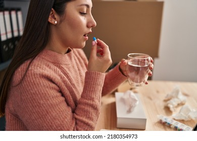 Young Hispanic Woman Ecommerce Business Worker Taking Pill At Office