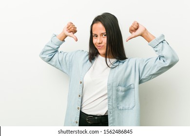 Young hispanic woman feels proud and self confident, example to follow. - Shutterstock ID 1562486845
