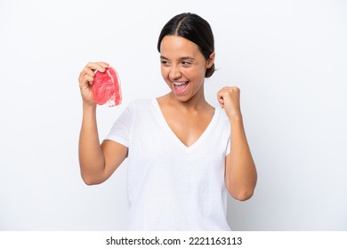 Young Hispanic Woman Holding A Piece Of Meat Isolated On White Background Celebrating A Victory