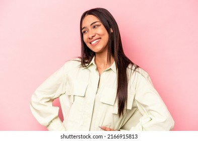 Young Hispanic Woman Isolated On Pink Background Confident Keeping Hands On Hips.