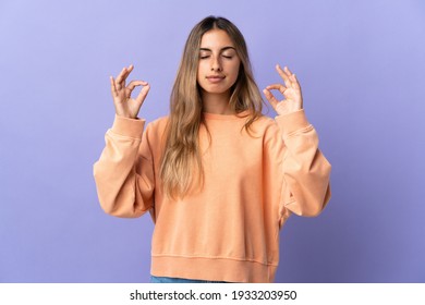Young Hispanic Woman Over Isolated Purple Background In Zen Pose