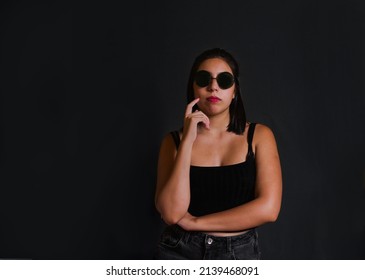 Young Hispanic Woman Portrait, Straight Hair. Wearing Sunglasses.