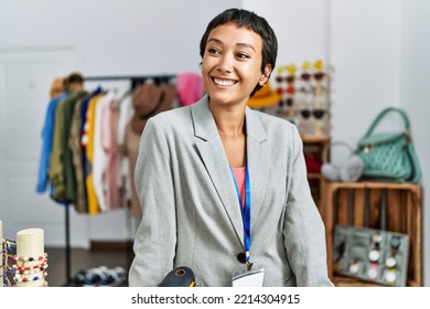 Young Hispanic Woman Shopkeeper Smiling Confident Working At Clothing Store