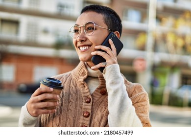 Young Hispanic Woman With Short Hair Smiling Happy Drinking A Cup Of Coffee And Talking On The Phone