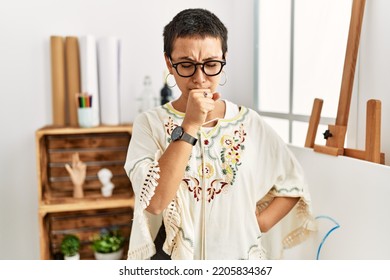 Young Hispanic Woman With Short Hair At Art Studio Feeling Unwell And Coughing As Symptom For Cold Or Bronchitis. Health Care Concept. 