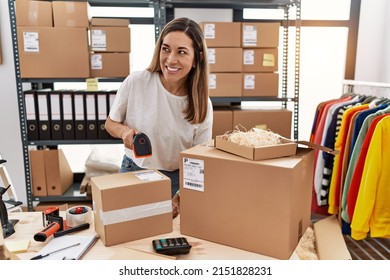 Young Hispanic Woman Smiling Confident Working At Store