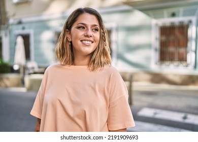 Young Hispanic Woman Smiling Confident At Street