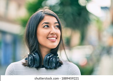 Young Hispanic Woman Smiling Happy Walking At The City.