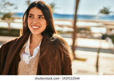 Young Hispanic Woman Smiling Happy Standing At The City.