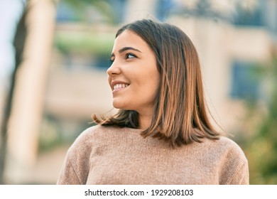 Young Hispanic Woman Smiling Happy Standing At The City.