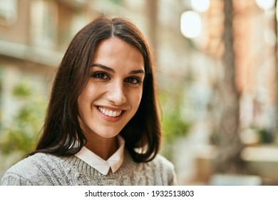 Young Hispanic Woman Smiling Happy Standing At The City.